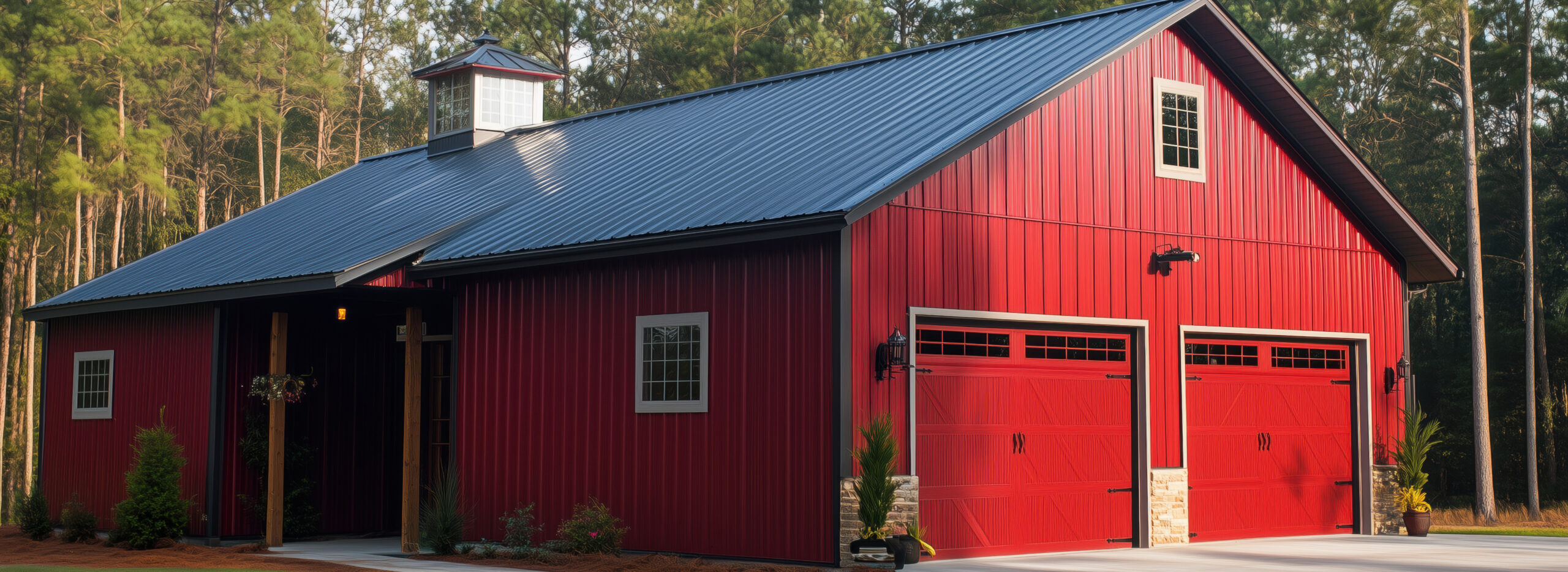 A Barndominium house style large red barn with a metal roof, fea